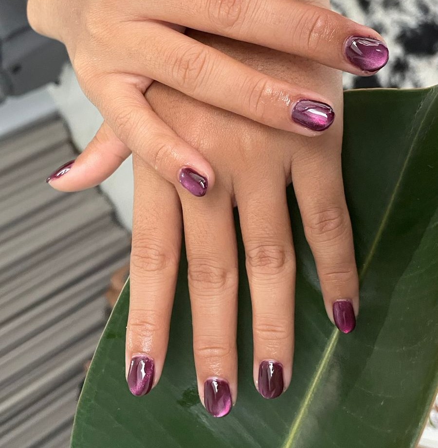 Purple cat-eye gel manicure at Lollygagss Studio Bali